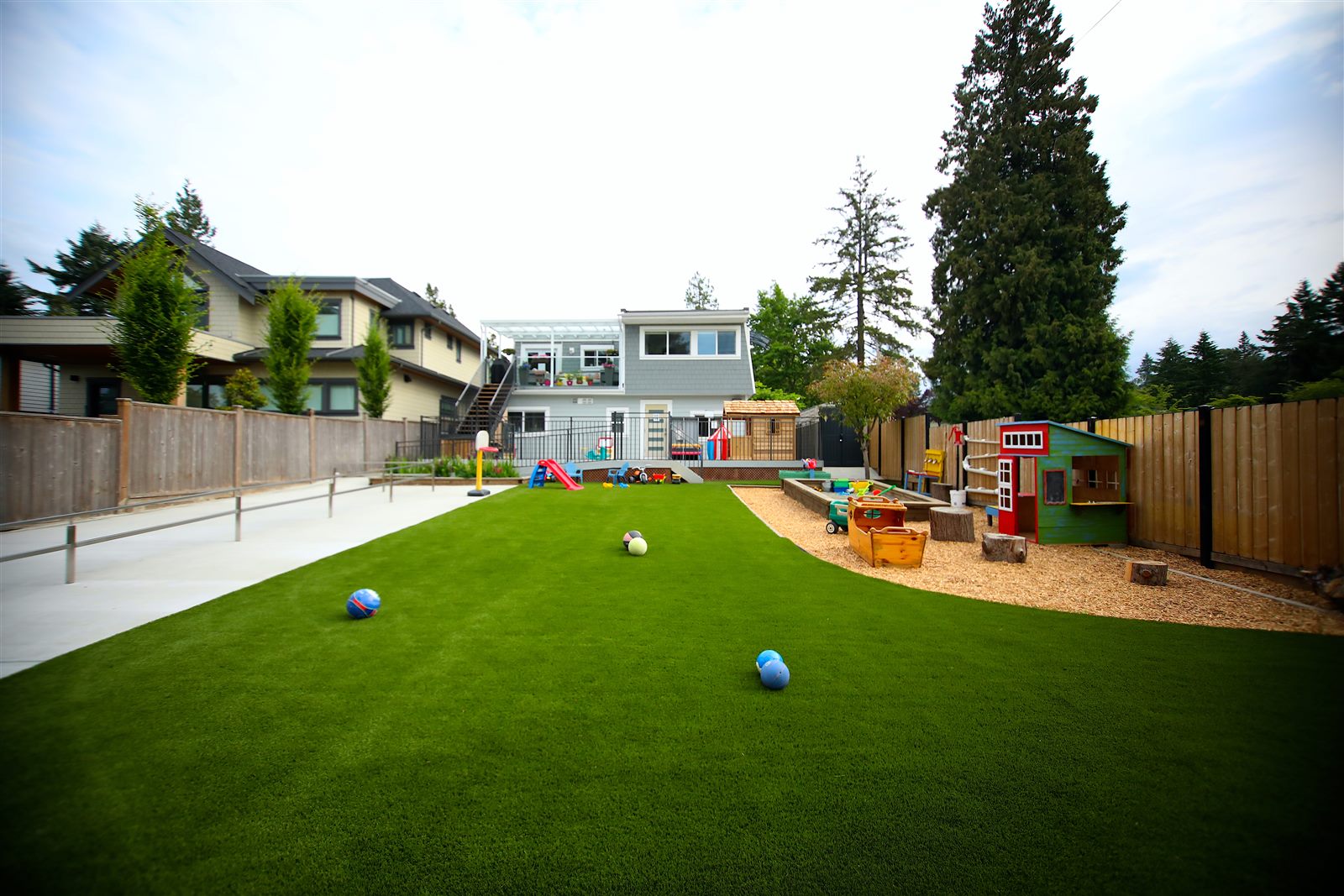 Expansive backyard with artificial turf